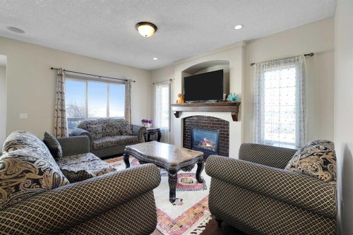 282 Pantego Terrace Nw, Calgary, AB - Indoor Photo Showing Living Room With Fireplace