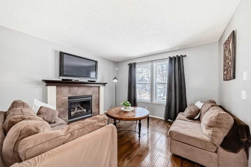 71 Covepark Rise Ne, Calgary, AB - Indoor Photo Showing Living Room With Fireplace