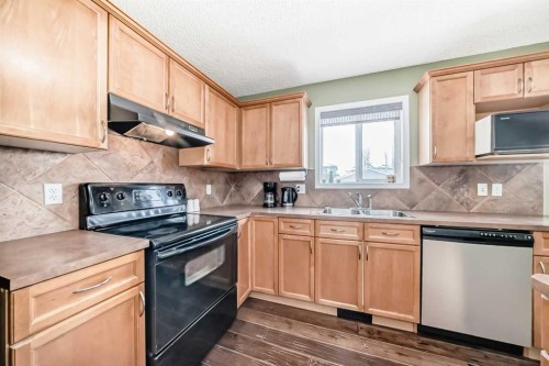 71 Covepark Rise Ne, Calgary, AB - Indoor Photo Showing Kitchen With Double Sink