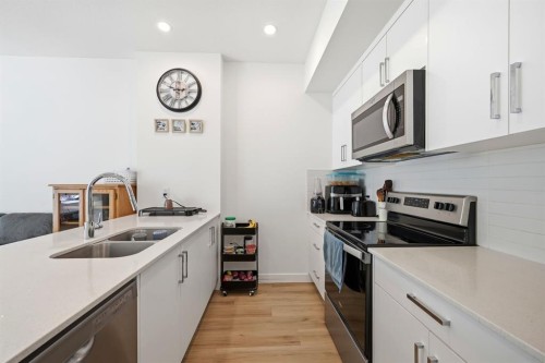 2216-151 Skyview Bay Ne, Calgary, AB - Indoor Photo Showing Kitchen With Stainless Steel Kitchen With Double Sink With Upgraded Kitchen