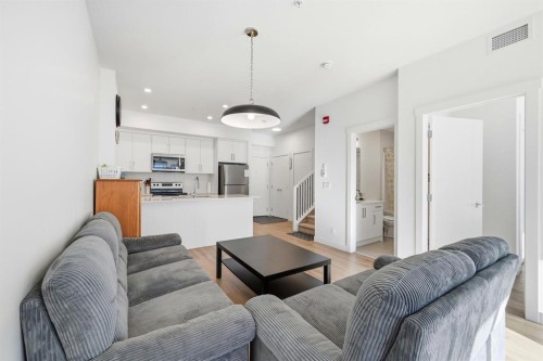 2216-151 Skyview Bay Ne, Calgary, AB - Indoor Photo Showing Living Room
