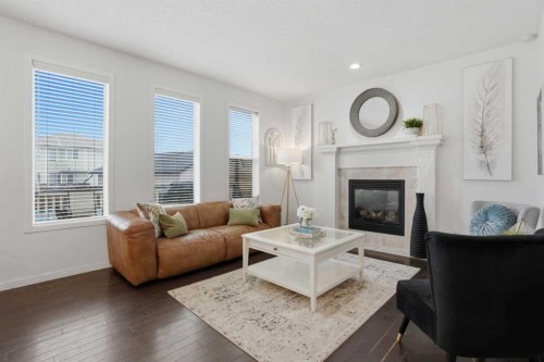 119 Prestwick Terrace Se, Calgary, AB - Indoor Photo Showing Living Room With Fireplace