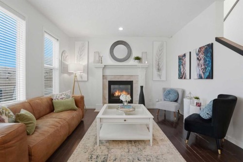 119 Prestwick Terrace Se, Calgary, AB - Indoor Photo Showing Living Room With Fireplace