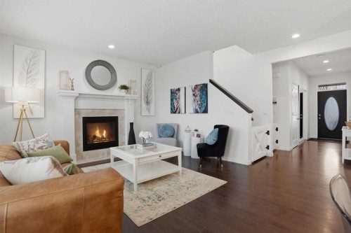 119 Prestwick Terrace Se, Calgary, AB - Indoor Photo Showing Living Room With Fireplace