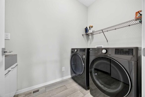 73 Yorkstone Heath Sw, Calgary, AB - Indoor Photo Showing Laundry Room