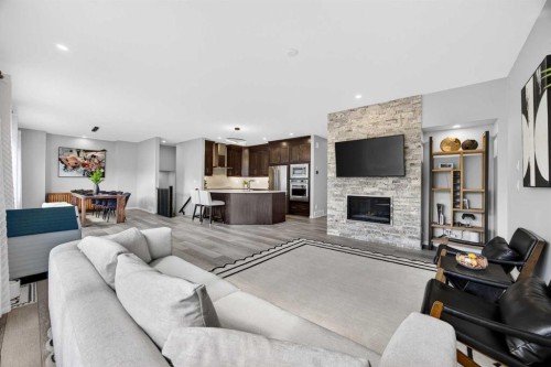 73 Yorkstone Heath Sw, Calgary, AB - Indoor Photo Showing Living Room With Fireplace