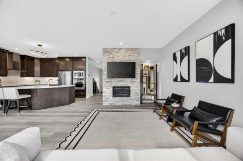 73 Yorkstone Heath Sw, Calgary, AB - Indoor Photo Showing Other Room With Fireplace