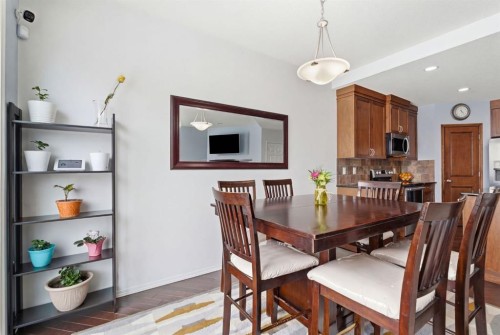 512 Panatella Square Nw, Calgary, AB - Indoor Photo Showing Dining Room
