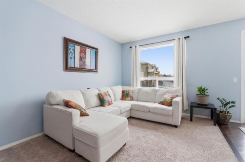 512 Panatella Square Nw, Calgary, AB - Indoor Photo Showing Living Room