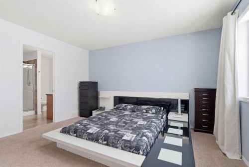 512 Panatella Square Nw, Calgary, AB - Indoor Photo Showing Bedroom