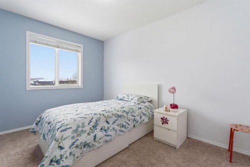 512 Panatella Square Nw, Calgary, AB - Indoor Photo Showing Bedroom