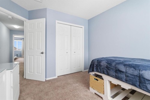 512 Panatella Square Nw, Calgary, AB - Indoor Photo Showing Bedroom
