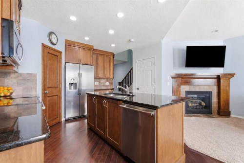 512 Panatella Square Nw, Calgary, AB - Indoor Photo Showing Kitchen With Stainless Steel Kitchen With Double Sink
