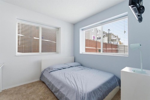 512 Panatella Square Nw, Calgary, AB - Indoor Photo Showing Bedroom