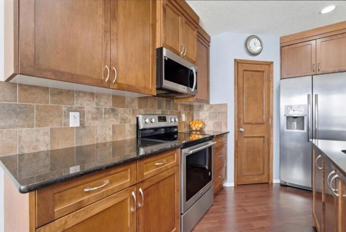512 Panatella Square Nw, Calgary, AB - Indoor Photo Showing Kitchen With Stainless Steel Kitchen