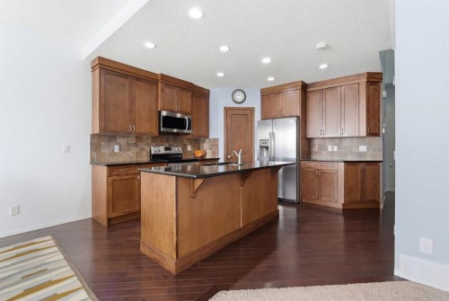512 Panatella Square Nw, Calgary, AB - Indoor Photo Showing Kitchen With Stainless Steel Kitchen