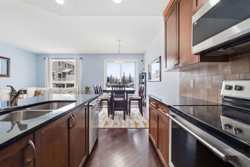 512 Panatella Square Nw, Calgary, AB - Indoor Photo Showing Kitchen With Double Sink