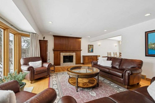 4104 Crestview Road Sw, Calgary, AB - Indoor Photo Showing Living Room With Fireplace