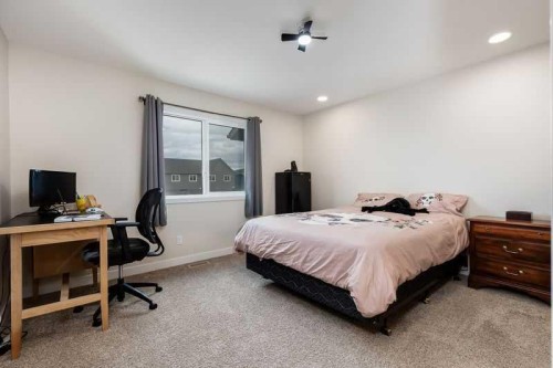 100 Langwell Common Se, Airdrie, AB - Indoor Photo Showing Bedroom