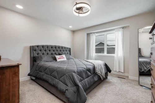 100 Langwell Common Se, Airdrie, AB - Indoor Photo Showing Bedroom