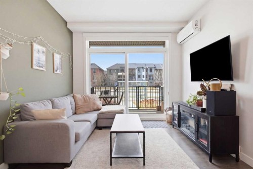 104-20 Walgrove Walk Se, Calgary, AB - Indoor Photo Showing Living Room With Fireplace