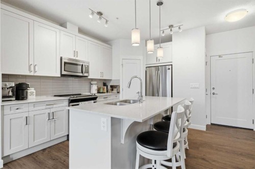 104-20 Walgrove Walk Se, Calgary, AB - Indoor Photo Showing Kitchen With Double Sink With Upgraded Kitchen