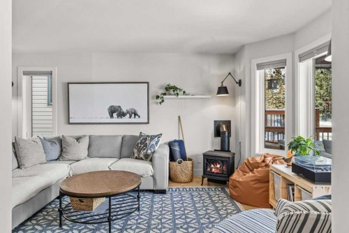 979 Wilson Way, Canmore, AB - Indoor Photo Showing Living Room With Fireplace