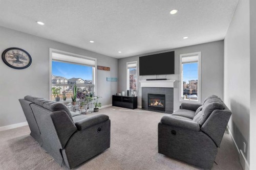 140 Rainbow Falls Heath, Chestermere, AB - Indoor Photo Showing Living Room With Fireplace