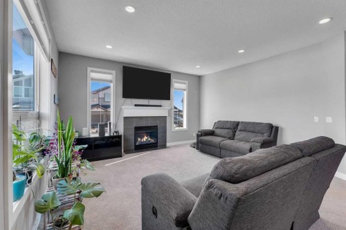 140 Rainbow Falls Heath, Chestermere, AB - Indoor Photo Showing Living Room With Fireplace