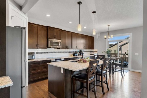 140 Rainbow Falls Heath, Chestermere, AB - Indoor Photo Showing Kitchen With Upgraded Kitchen