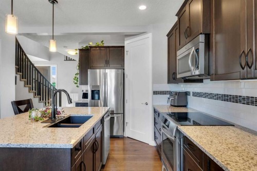 140 Rainbow Falls Heath, Chestermere, AB - Indoor Photo Showing Kitchen With Double Sink With Upgraded Kitchen