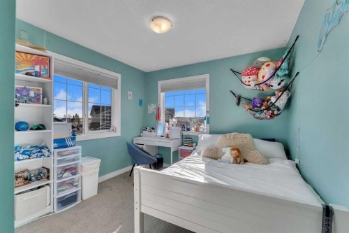 140 Rainbow Falls Heath, Chestermere, AB - Indoor Photo Showing Bedroom
