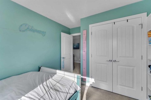 140 Rainbow Falls Heath, Chestermere, AB - Indoor Photo Showing Bedroom