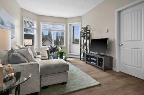 219-8 Prestwick Pond Terrace Se, Calgary, AB - Indoor Photo Showing Living Room