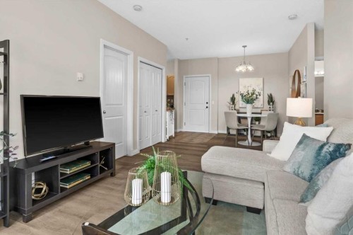 219-8 Prestwick Pond Terrace Se, Calgary, AB - Indoor Photo Showing Living Room