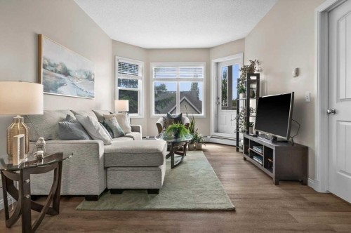 219-8 Prestwick Pond Terrace Se, Calgary, AB - Indoor Photo Showing Living Room