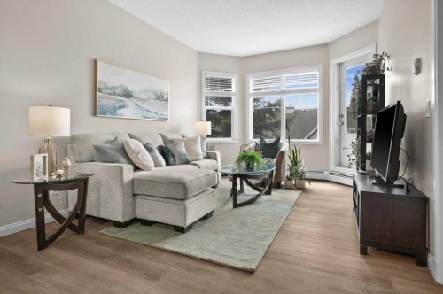 219-8 Prestwick Pond Terrace Se, Calgary, AB - Indoor Photo Showing Living Room
