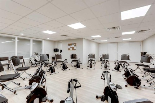404-2635 Eversyde Avenue Sw, Calgary, AB - Indoor Photo Showing Gym Room