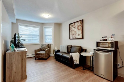404-2635 Eversyde Avenue Sw, Calgary, AB - Indoor Photo Showing Living Room