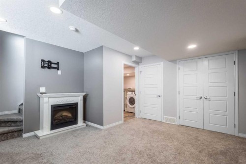 271 Windford Crescent Sw, Airdrie, AB - Indoor With Fireplace