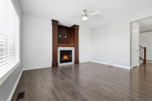 196 Evansborough Way Nw, Calgary, AB - Indoor Photo Showing Living Room With Fireplace