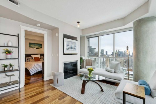 1701-836 15 Avenue, Calgary, AB - Indoor Photo Showing Living Room With Fireplace