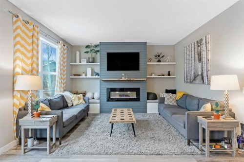 173 Auburn Sound Close Se, Calgary, AB - Indoor Photo Showing Living Room With Fireplace