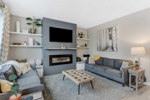 173 Auburn Sound Close Se, Calgary, AB - Indoor Photo Showing Living Room With Fireplace