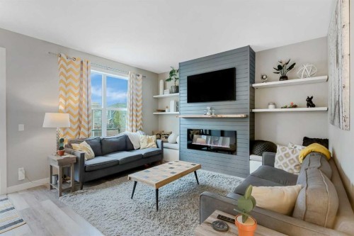 173 Auburn Sound Close Se, Calgary, AB - Indoor Photo Showing Living Room With Fireplace