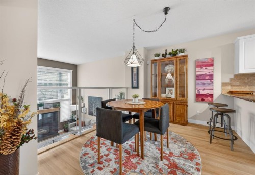 86 Inglewood Point Se, Calgary, AB - Indoor Photo Showing Dining Room With Fireplace