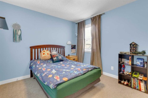21 Masters Place Se, Calgary, AB - Indoor Photo Showing Bedroom