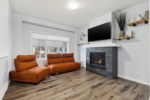 27 Masters Manor Se, Calgary, AB - Indoor Photo Showing Living Room With Fireplace