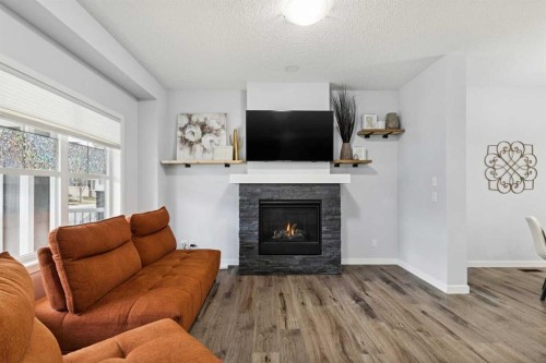 27 Masters Manor Se, Calgary, AB - Indoor Photo Showing Living Room With Fireplace
