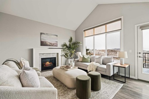 106-55 Fireside Circle, Cochrane, AB - Indoor Photo Showing Living Room With Fireplace
